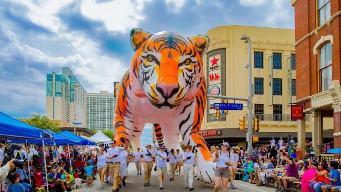 Trinity's large tiger-shaped balloon in the Battle of Flowers Parade